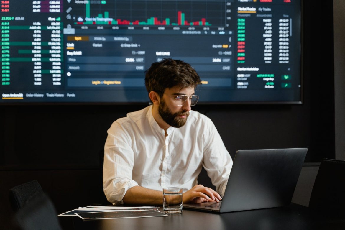 Man in White Dress Shirt Using Black Laptop Computer